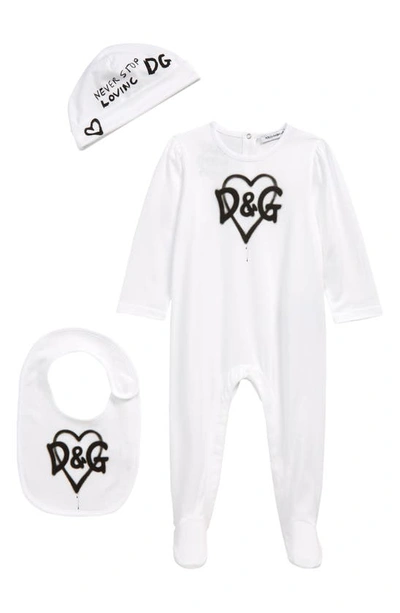 Shop Dolce & Gabbana Graffiti Logo Bodysuit, Beanie & Bib Set In White Print