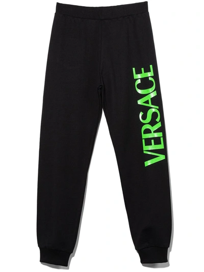 Shop Versace Teen Logo-print Cotton Track Pants In 黑色