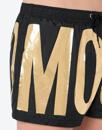 Shop Moschino Gold Logo Beach Boxer In Black