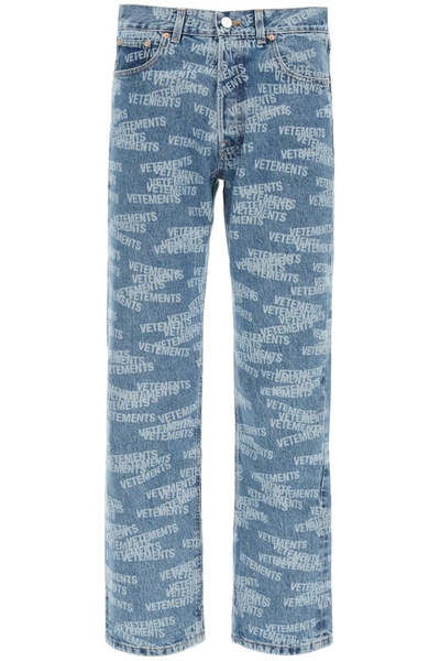 Shop Vetements Monogram Print Jeans In Medium Blue (blue)
