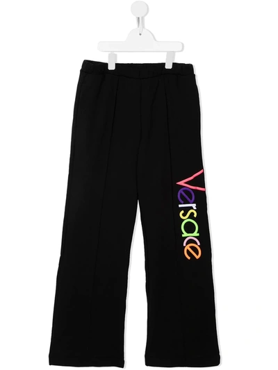 Shop Versace Multicolour-logo Wide Trousers In Black