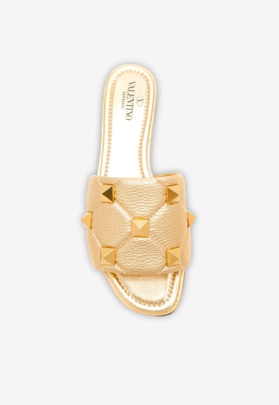 Shop Valentino Roman Stud Quilted Metallic Leather Flat Slides In Gold