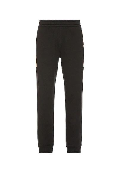 Shop Burberry Side Check Panel Joggers In Black