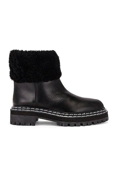 Shop Proenza Schouler Lug Sole Shearling Ankle Boots In Black