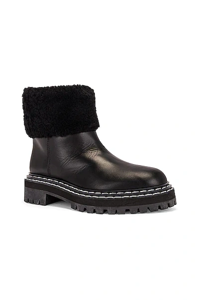 Shop Proenza Schouler Lug Sole Shearling Ankle Boots In Black