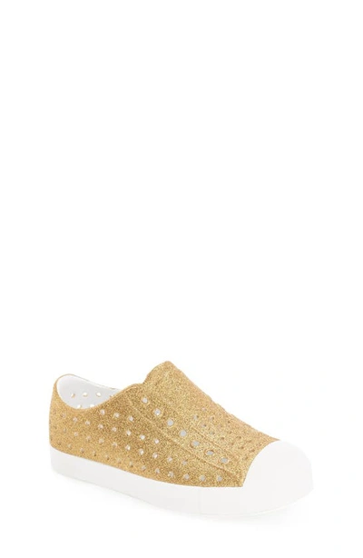 Shop Native Shoes Jefferson Bling Glitter Slip-on Vegan Sneaker In Gold Bling/ Shell White