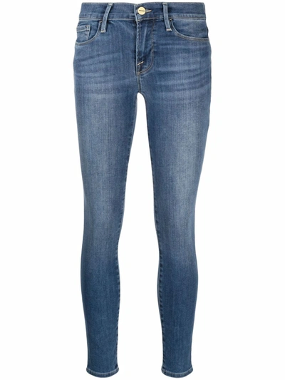 Shop Frame Low-rise Skinny Jeans In Blue