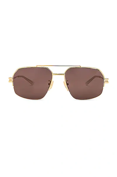 Shop Bottega Veneta Lock Metal Sunglasses In Shiny Gold Lv
