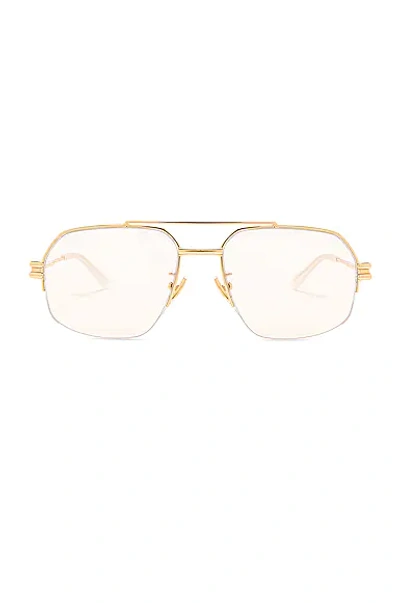 Shop Bottega Veneta Lock Metal Sunglasses In Shiny Gold Lv
