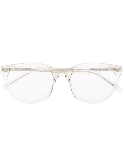 Shop Saint Laurent Round Frame Glasses In Neutrals