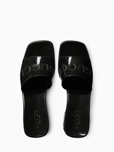 Shop Gucci Rubber Slider Sandal In Black