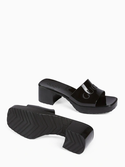 Shop Gucci Rubber Slider Sandal In Black