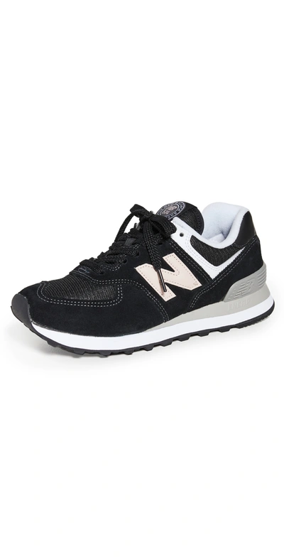 Shop New Balance 574 Classic Sneakers