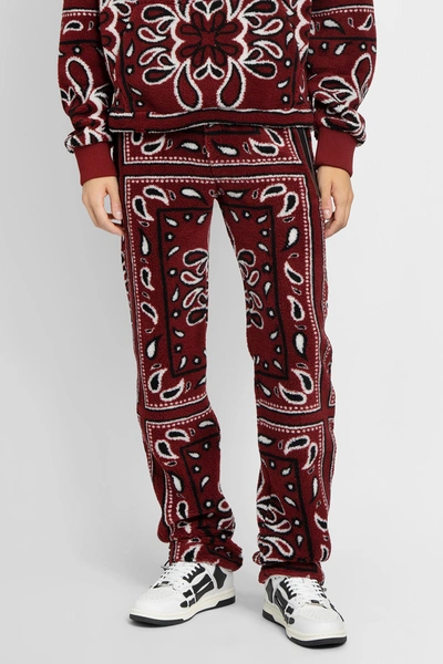 Shop Amiri Trousers In Red