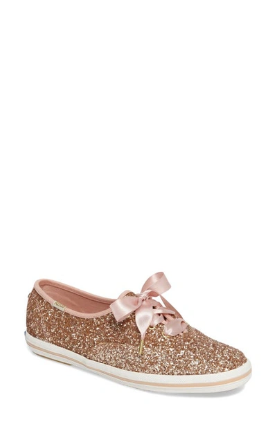 Shop Kate Spade Glitter Sneaker In Rose Gold