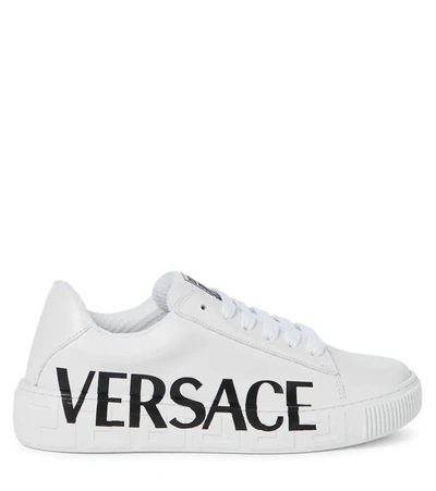 Shop Versace Logo Leather Sneakers In Bianco+nero