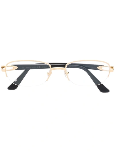 Shop Cartier Oval Frame Glasses In Gold