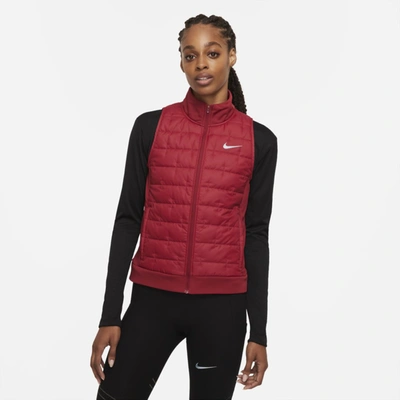 Shop Nike Therma-fit Women's Synthetic-fill Running Vest In Pomegranate