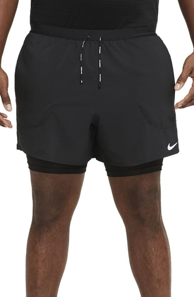 Shop Nike Dri-fit Flex Stride Pocket 2-in-1 Running Shorts In Black/ Black
