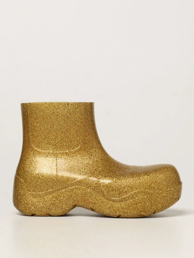 Shop Bottega Veneta Puddle Ankle Boot In Rubber With Glitter In Gold