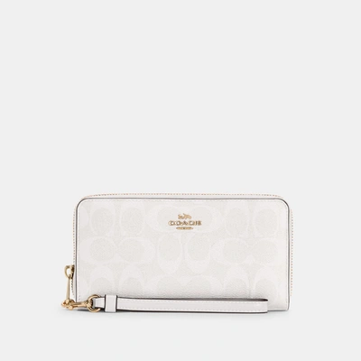 COACH®  Long Zip Around Wallet In Signature Canvas With Jumbo