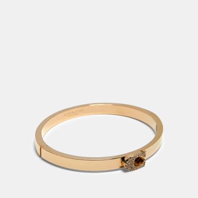 Shop Coach Pave Signature Hinged Bangle In Yellow