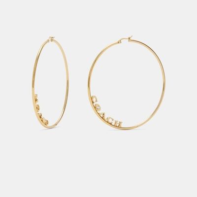 Shop Coach Signature Large Hoop Earrings In Yellow
