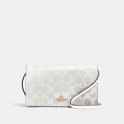 Shop Coach Anna Foldover Clutch Crossbody In Signature Canvas In White