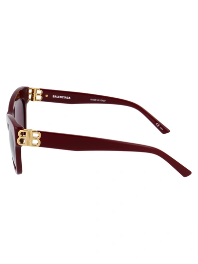 Shop Balenciaga Sunglasses In 004 Burgundy Gold Red