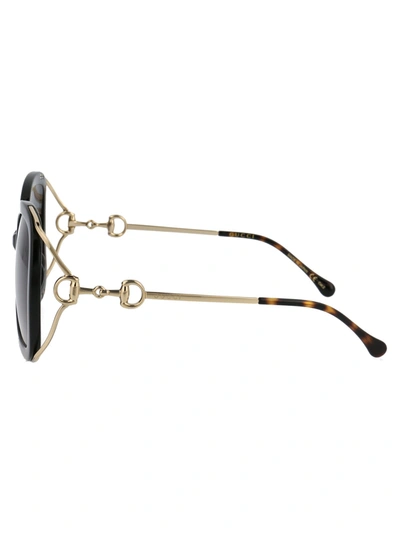 Shop Gucci Sunglasses In 002 Black Gold Grey