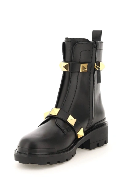 Shop Valentino Roman Stud Leather Combat Boot In Black