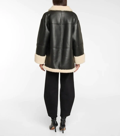 Shop Totême Oversized Shearling Jacket In Black Off White