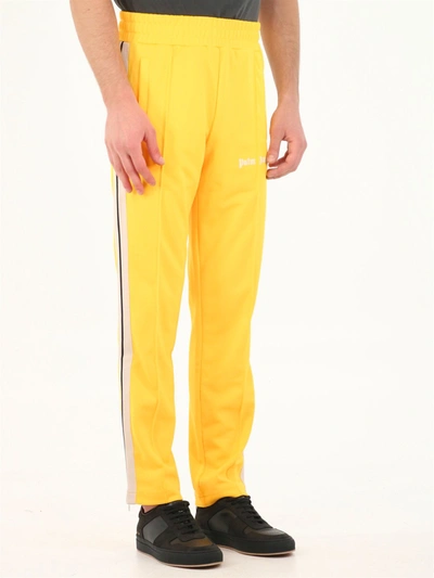 Shop Palm Angels Track Pants Yellow