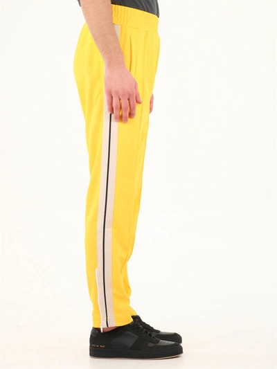 Shop Palm Angels Track Pants Yellow