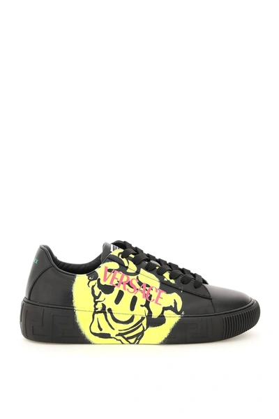 Shop Versace Greca Sneakers With Medusa Smile Print In Nero Bright Yellow (black)