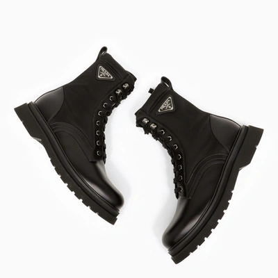 Prada Logo-plaque Panelled Ankle Boots In Black