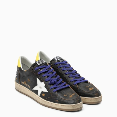 Shop Golden Goose Black/yellow/white Ballstar Sneakers