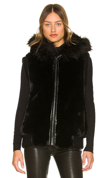 Shop Jocelyn Hooded Faux Fur Bomber Vest In 블랙