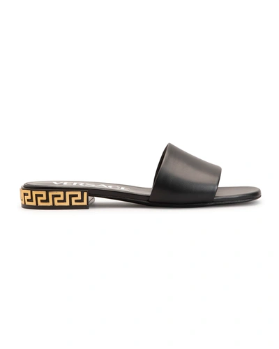 Shop Versace Greca Calfskin Flat Mule Sandals In Black  Gol