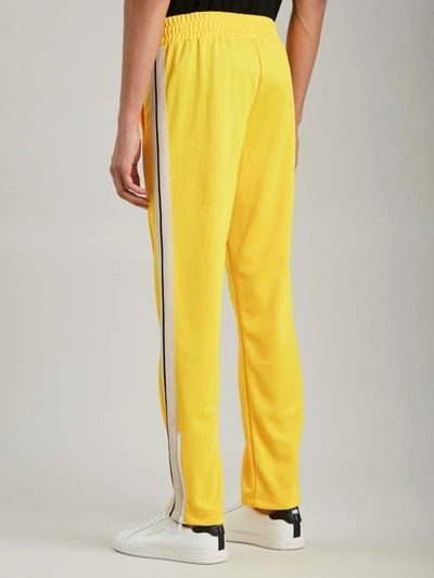 Shop Palm Angels Trousers Yellow