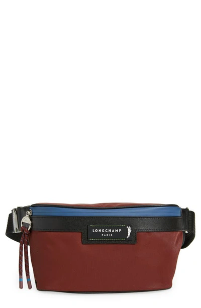 Shop Longchamp Belt Bag In Burgundy
