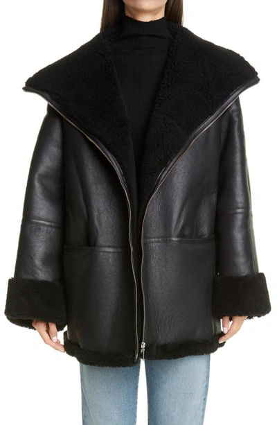 Shop Totême Menfi Oversize Genuine Shearling Coat In Black