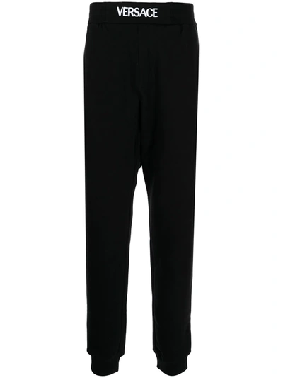 Shop Versace Logo-waistband Jersey Track Pants In Black
