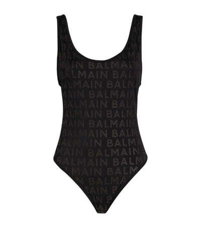 Shop Balmain Logo Embossed Swimsuit In Black