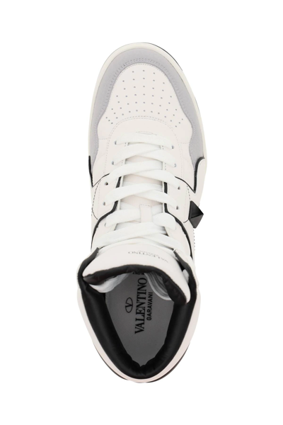 Shop Valentino One Stud Hi-top Sneakers In White,black,grey