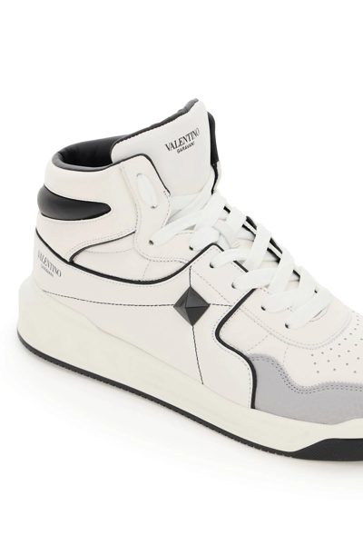 Shop Valentino One Stud Hi-top Sneakers In White,black,grey