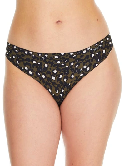 Shop Calvin Klein Printed Invisibles Thong In Fatigues