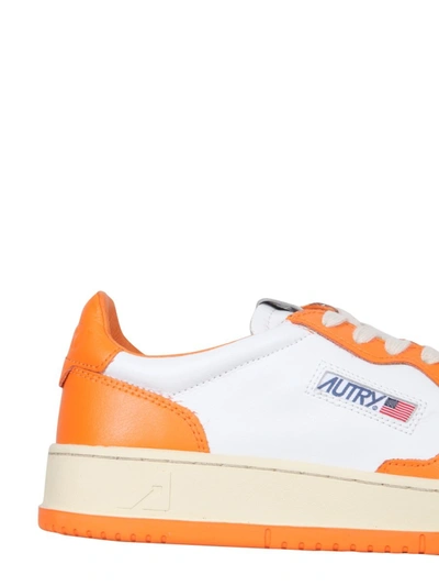 Shop Autry Leather Sneakers In Orange