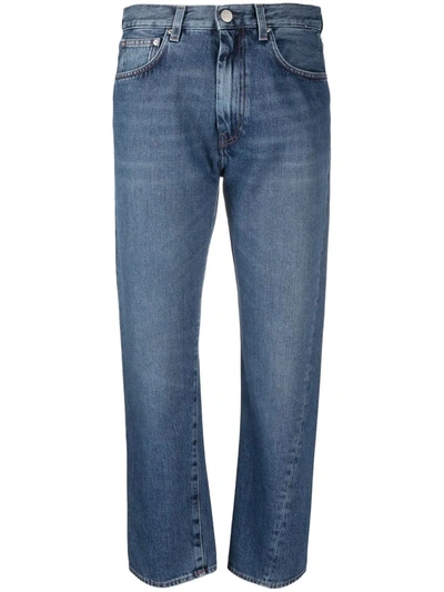 Shop Totême Twisted Seam Mid-rise Jeans In Blau