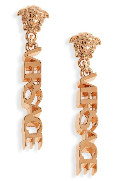 Shop Versace Signature Logo Drop Earrings In  Gold